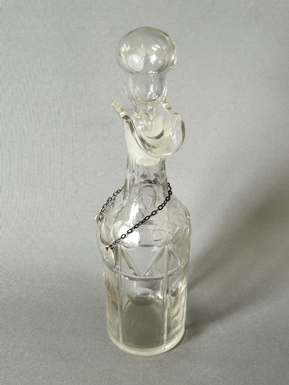An unusual Edwardian cut glass vinegar bottle & silver label View VIII