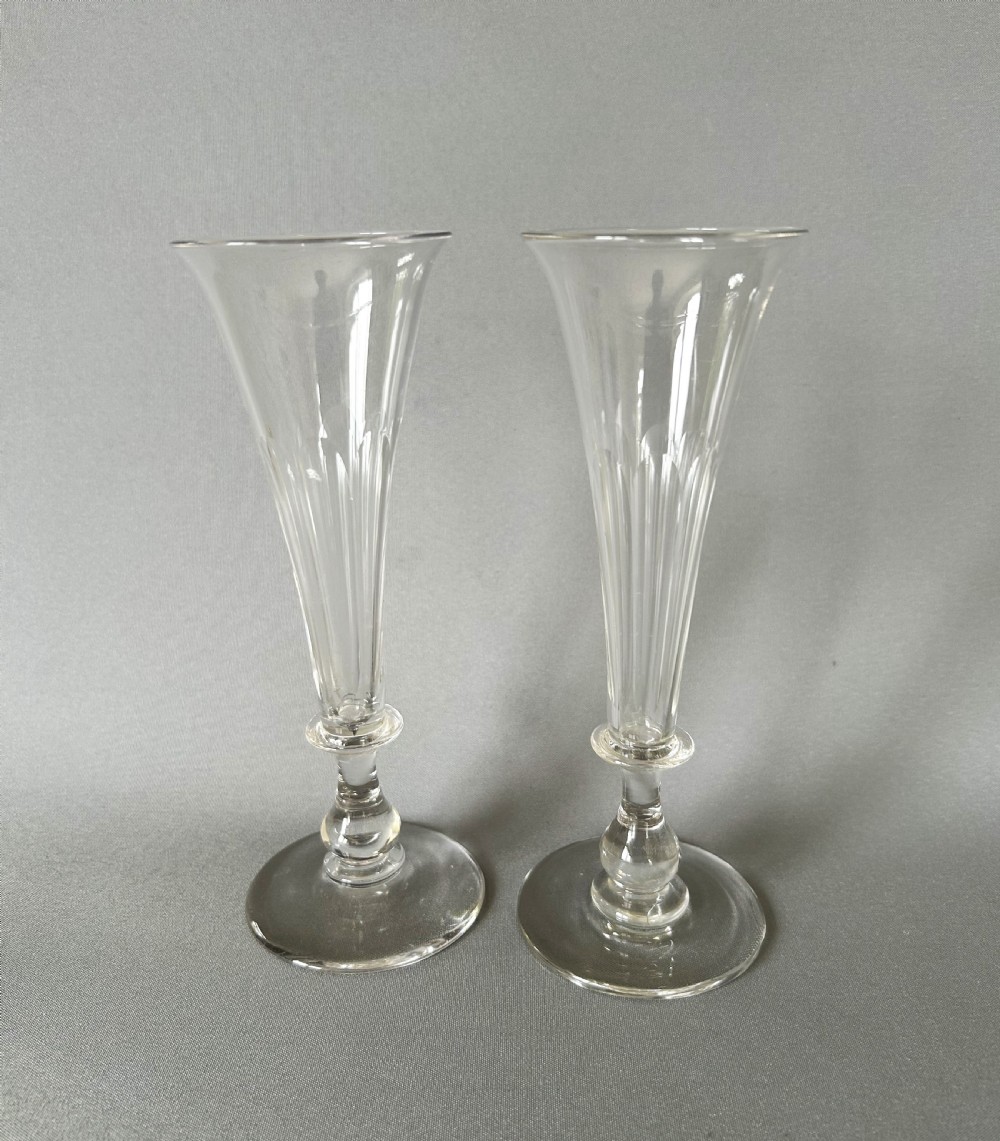 A pair of early Victorian cut glass champagne flutes