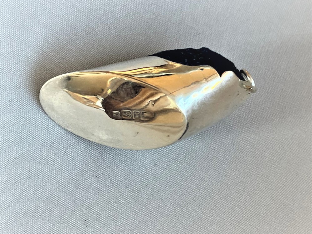 A rare Victorian silver 'hoof' pin cushion View V