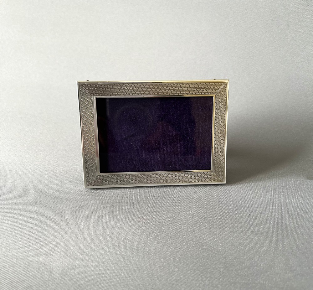 A small silver landscape/portrait photo frame View II