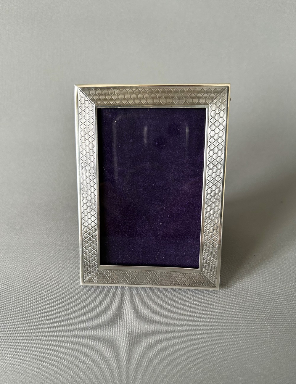 A small silver landscape/portrait photo frame View V