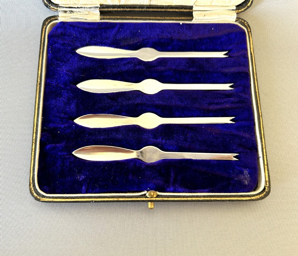 A rare set of 4 boxed silver crab picks View II
