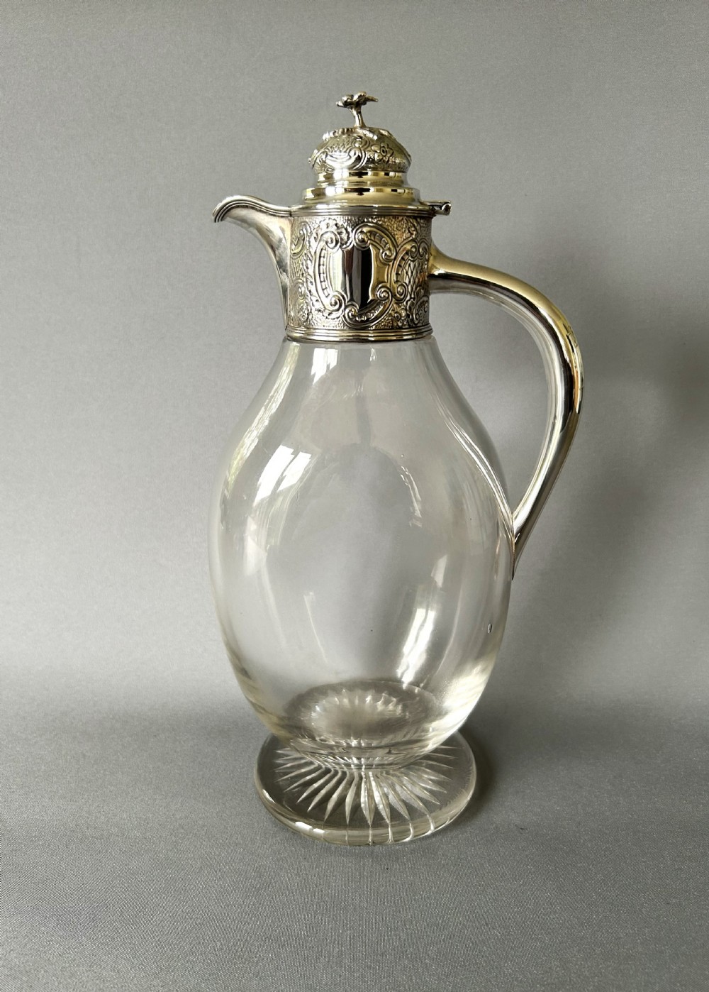 An elegant Victorian silver mounted claret jug