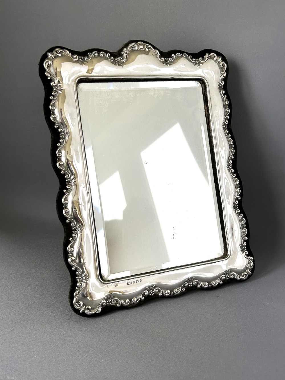 A handsome Edwardian silver table mirror