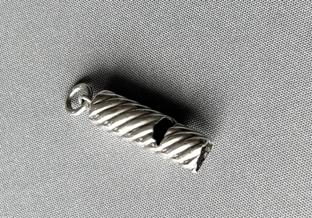 A Sampson Morden small silver dog whistle