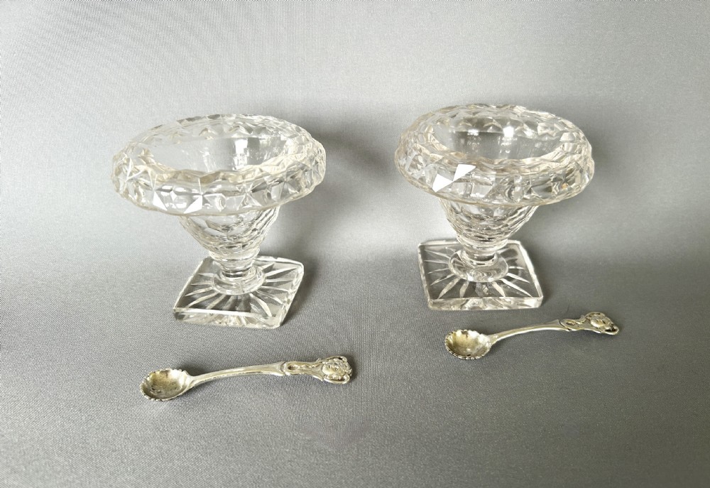 A superb pair of Victorian cut glass condiment bowls & silver spoons
