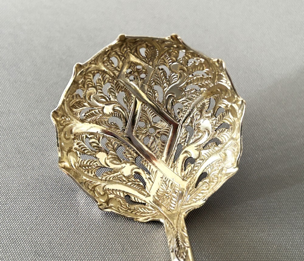 A fabulous Georgian silver sugar sifter spoon View II