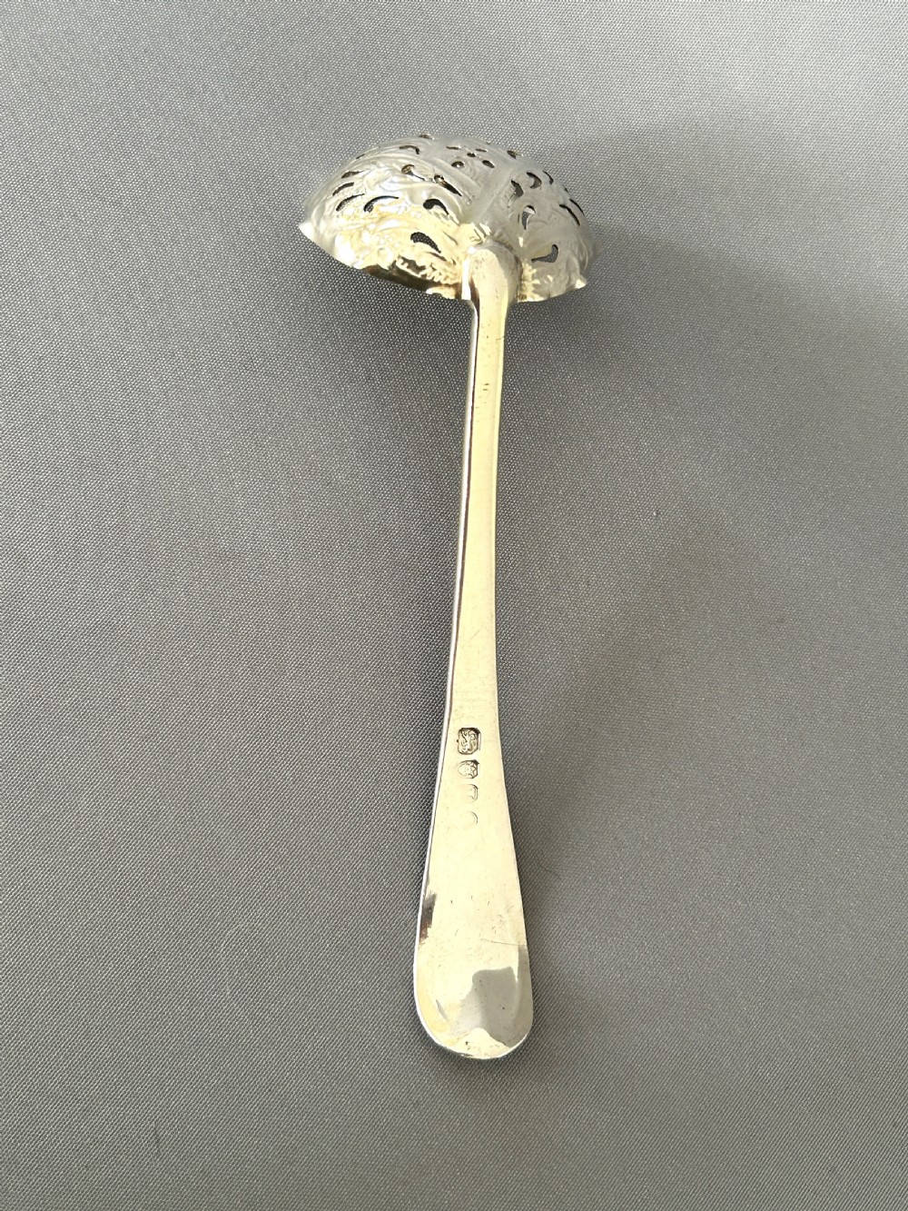 A fabulous Georgian silver sugar sifter spoon View IV