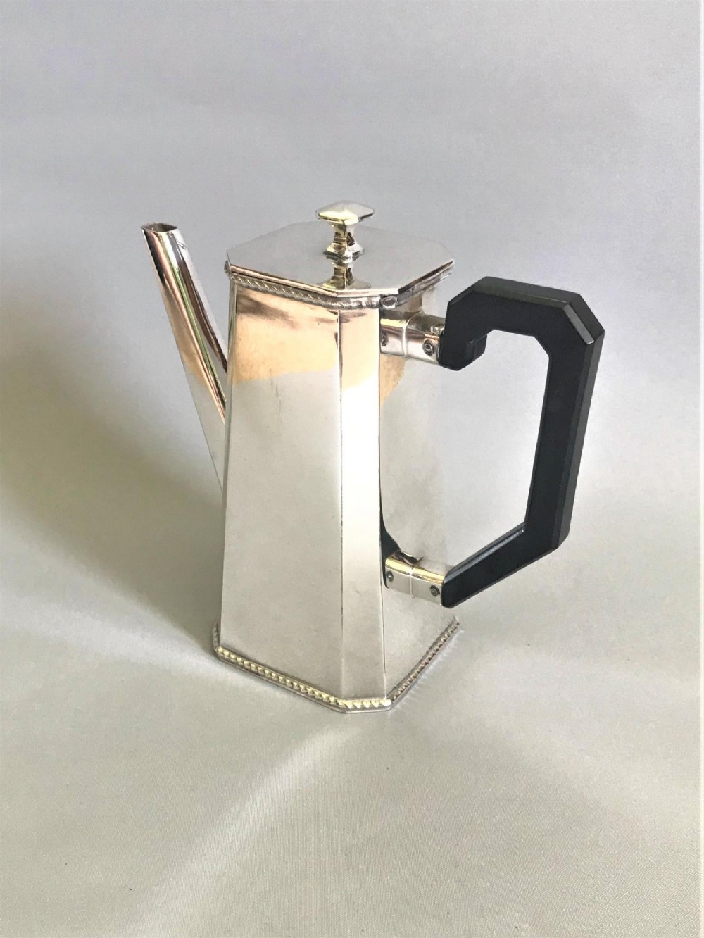 An Art Deco silver plated chocolate pot