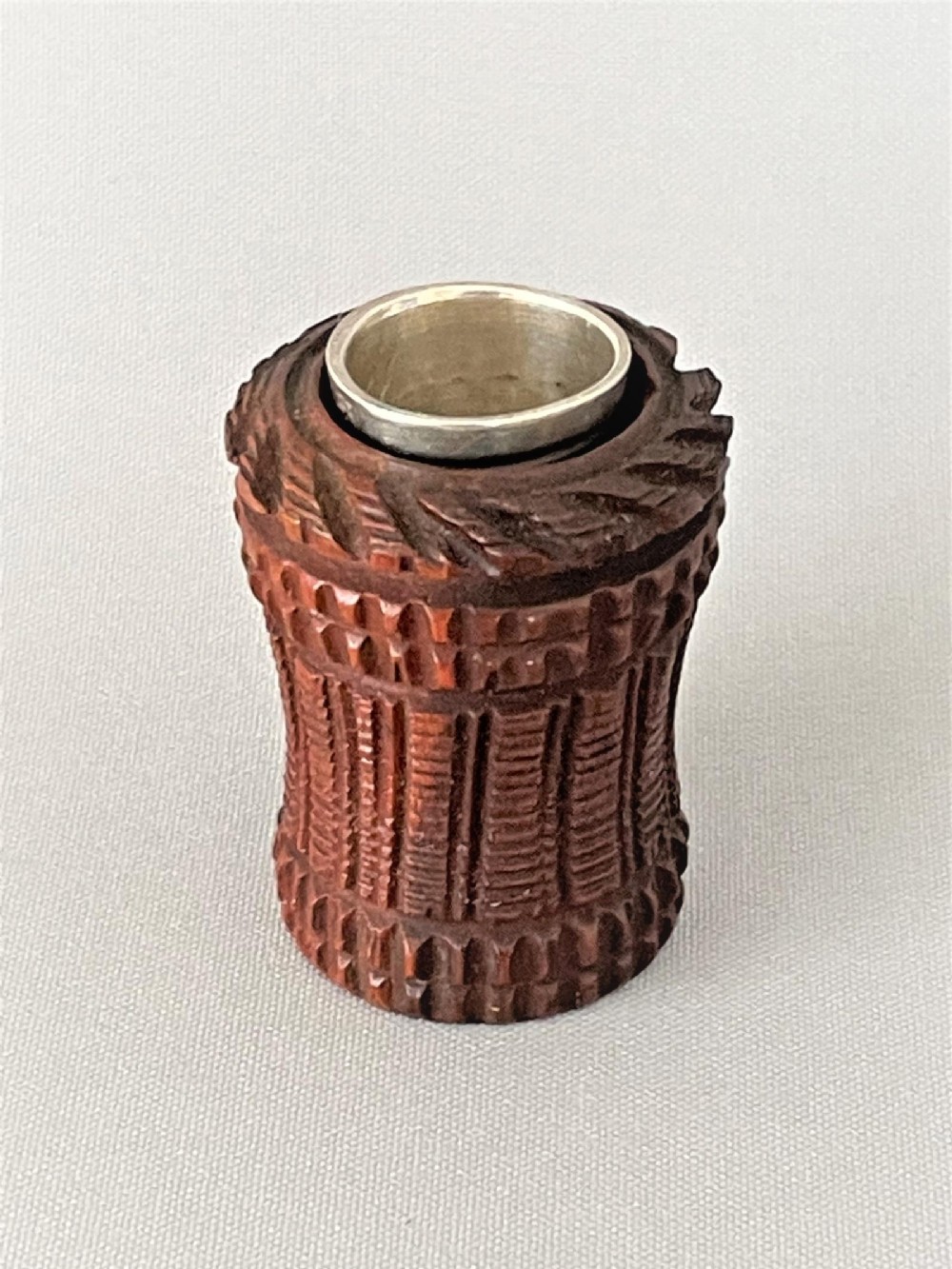An Edwardian coquilla nut thimble case & silver thimble