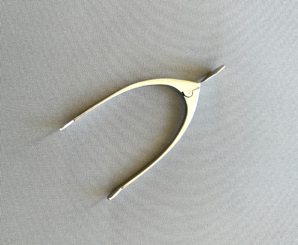 A pair of novelty silver wishbone sugar tongs