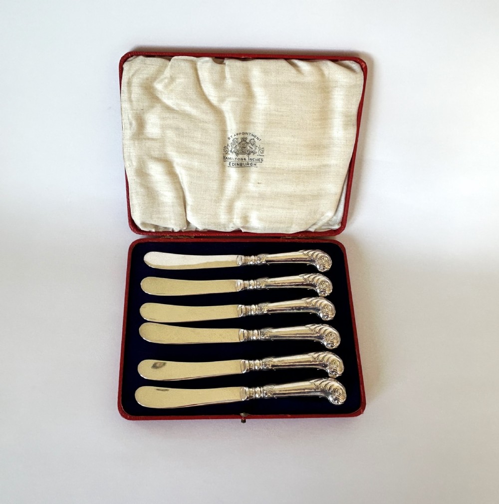A boxed set of 6 Edwardian silver handled butter knives View II