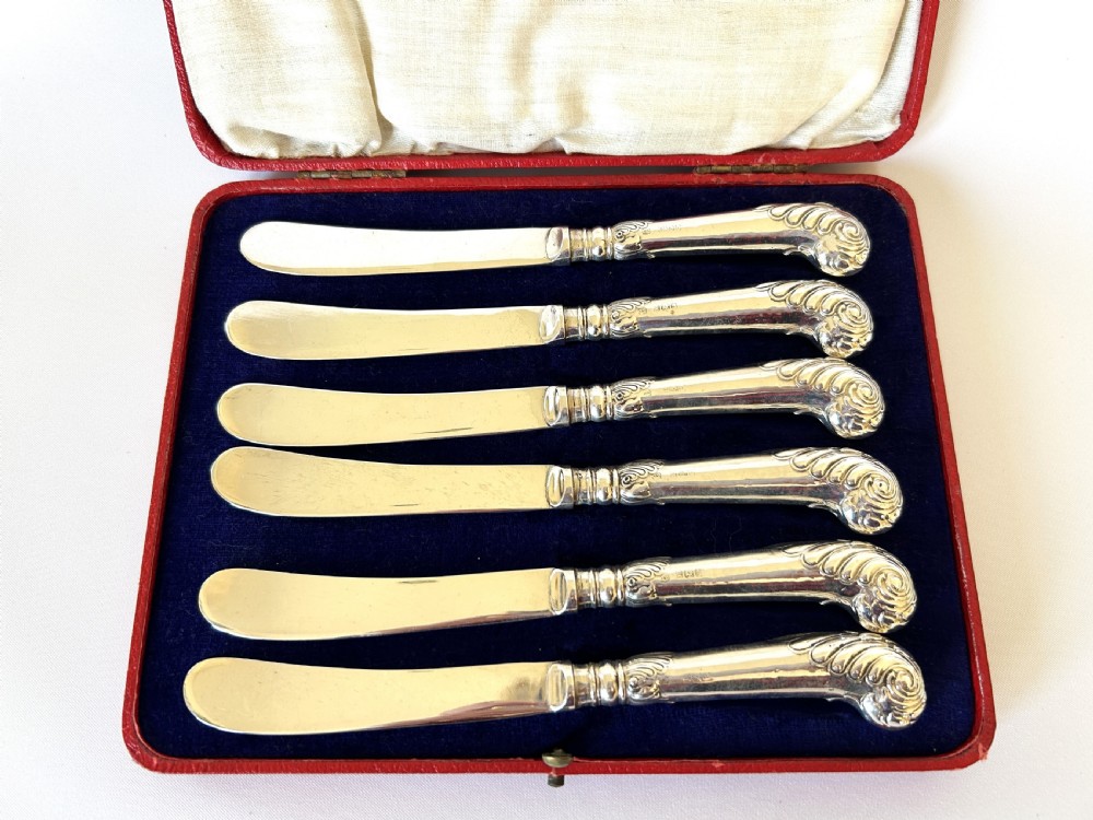 A boxed set of 6 Edwardian silver handled butter knives View IV