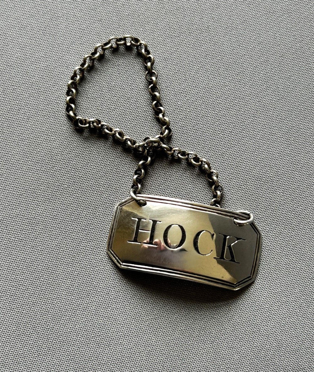 A rare Georgian silver 'Hock' decanter label