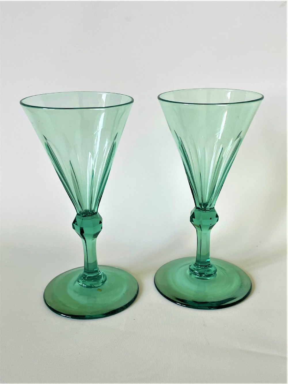 A gorgeous pair of pale green early Victorian wine flutes