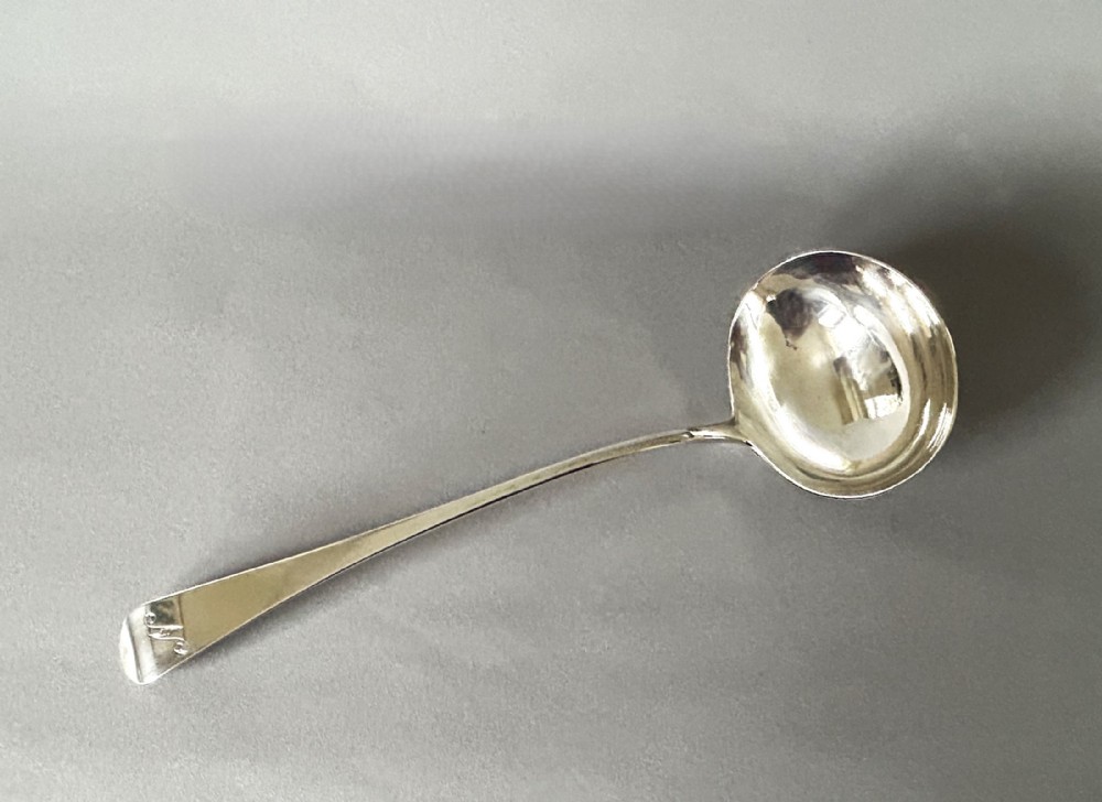 A handsome Georgian silver soup ladle