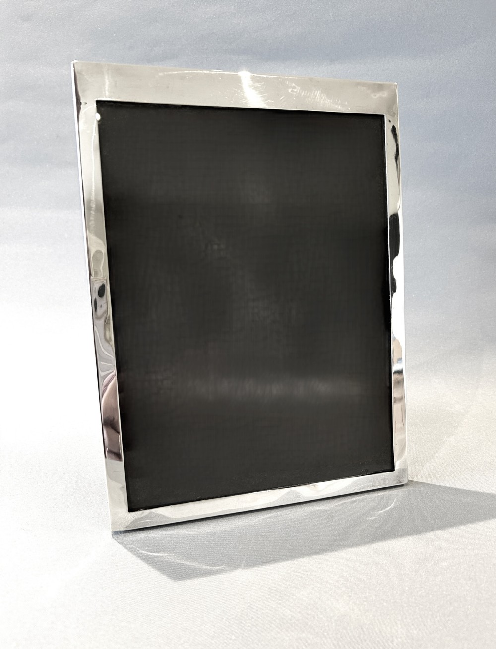 A large Art Deco period silver photo frame