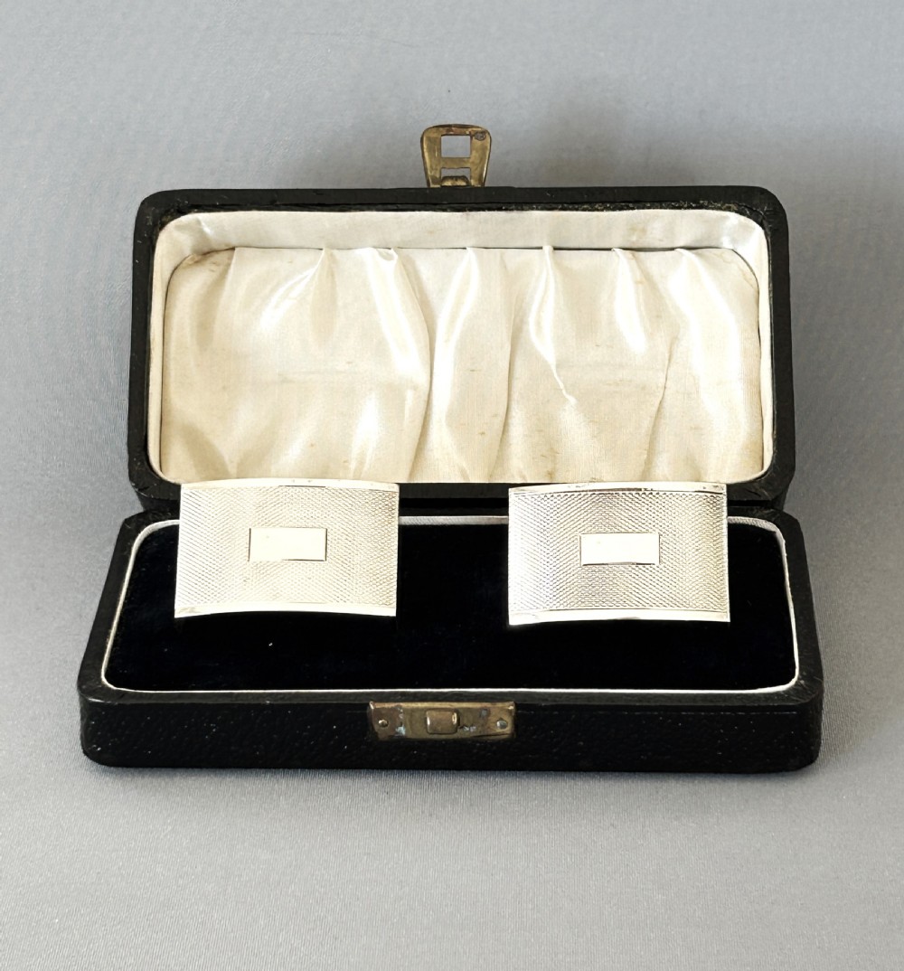 A stylish pair of Art Deco boxed silver napkin rings View II