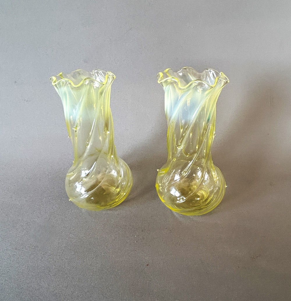 A gorgeous pair of Victorian uranium vaseline glass posy vases