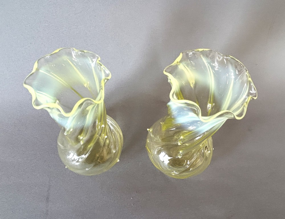 A gorgeous pair of Victorian uranium vaseline glass posy vases View V