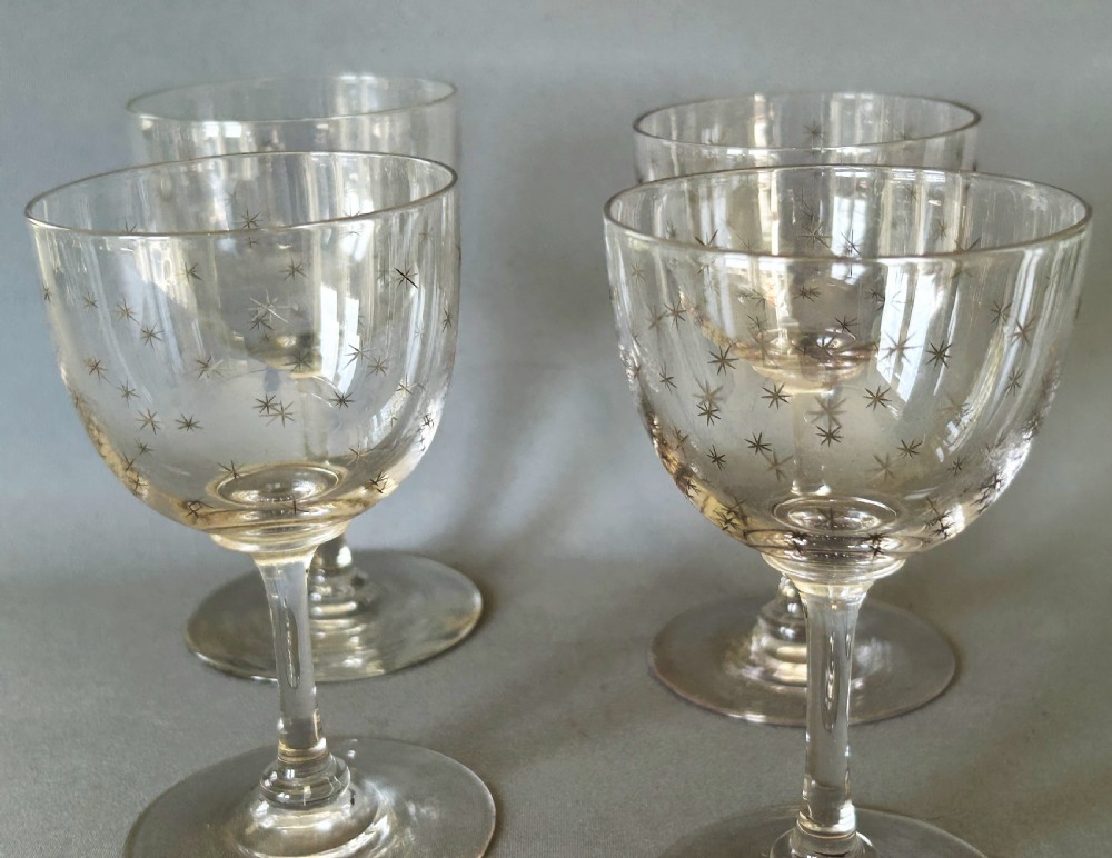 A charming set of 4 Victorian star etched dessert wine glasses View II