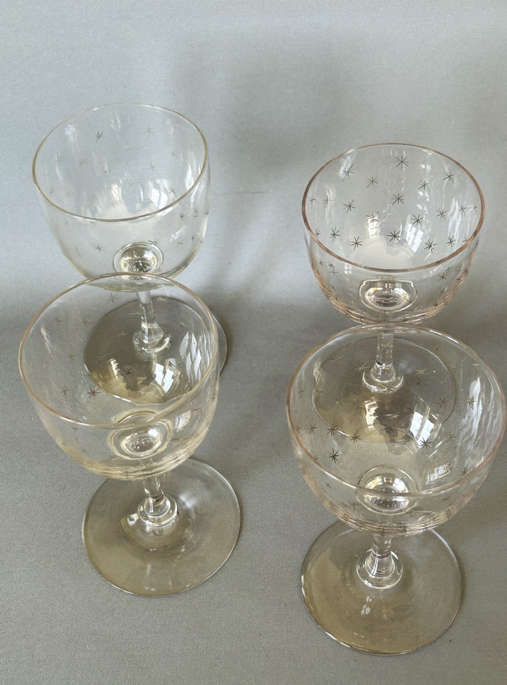 A charming set of 4 Victorian star etched dessert wine glasses View III
