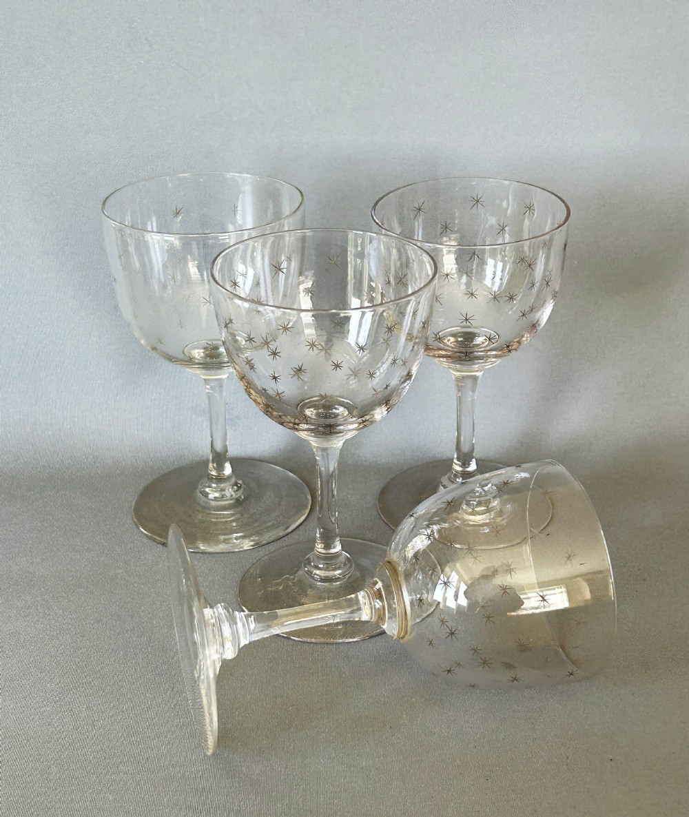 A charming set of 4 Victorian star etched dessert wine glasses View IV