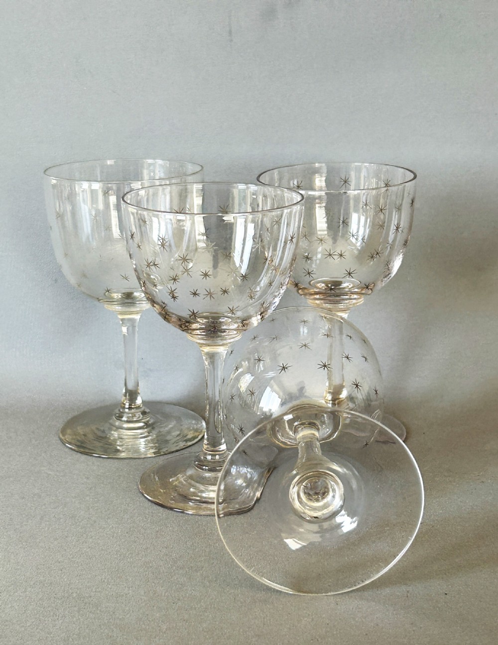 A charming set of 4 Victorian star etched dessert wine glasses View V