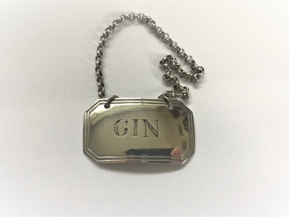 A Rare Transitional hallmark Victorian silver Gin label