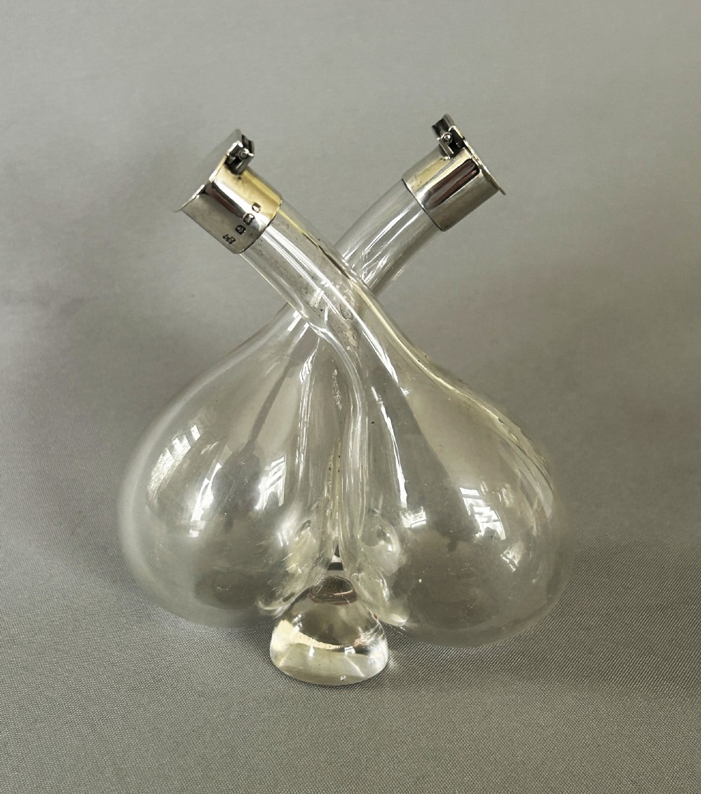 A charming Edwardian small silver mounted oil & vinegar duo View II