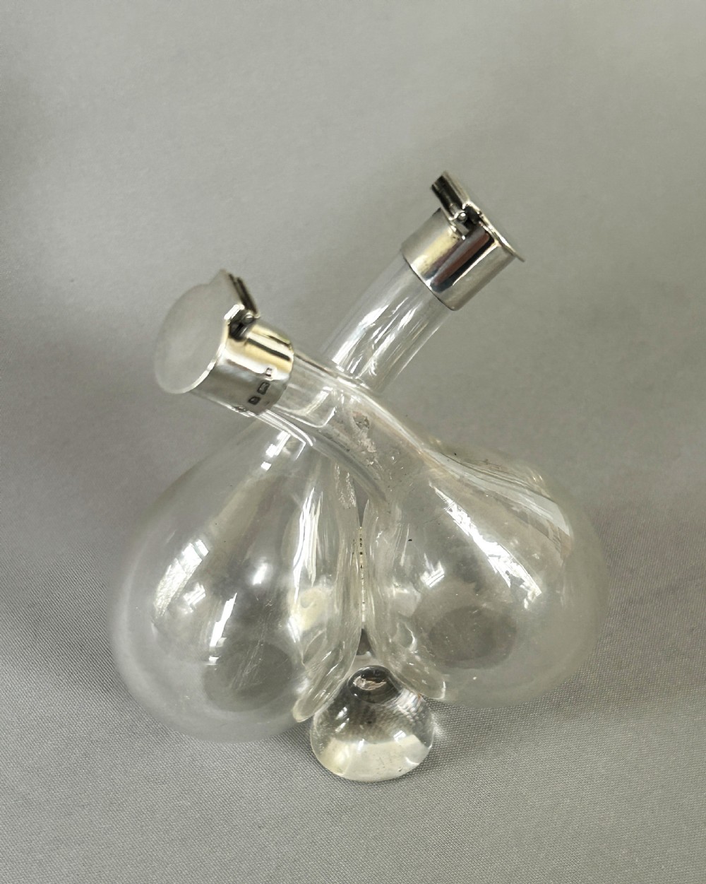 A charming Edwardian small silver mounted oil & vinegar duo View III