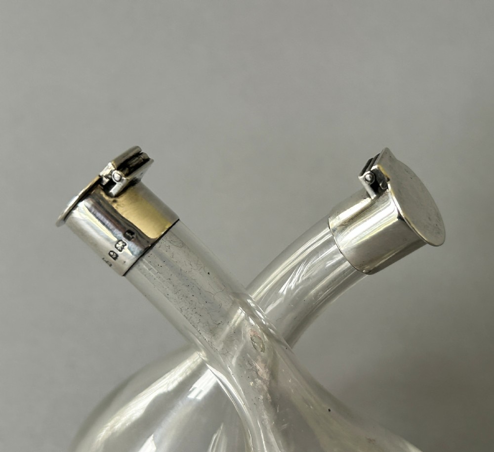 A charming Edwardian small silver mounted oil & vinegar duo View VI