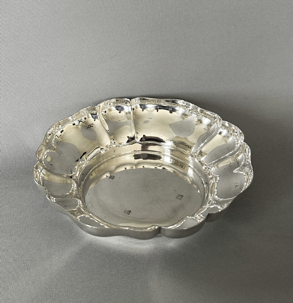 A handsome vintage silver wine bottle/decanter coaster