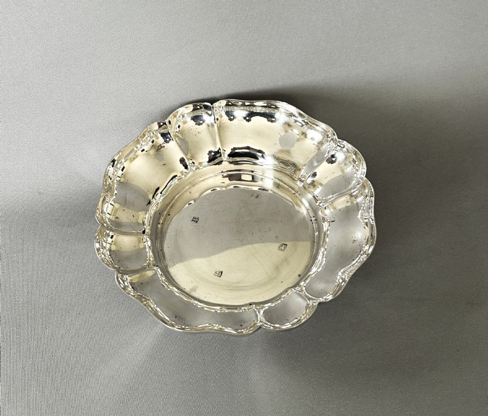 A handsome vintage silver wine bottle/decanter coaster View II