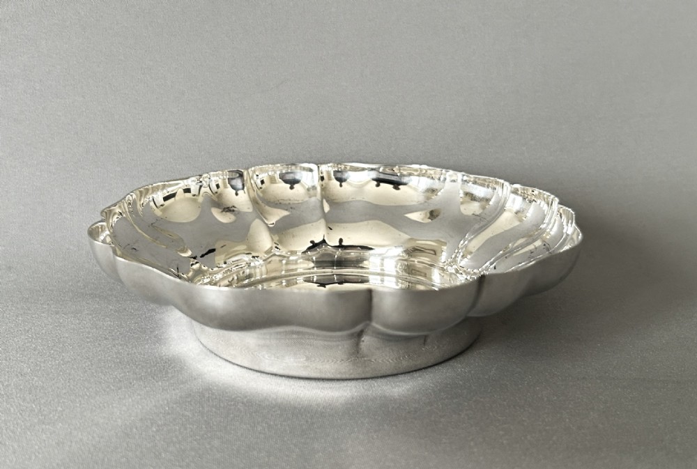 A handsome vintage silver wine bottle/decanter coaster View III