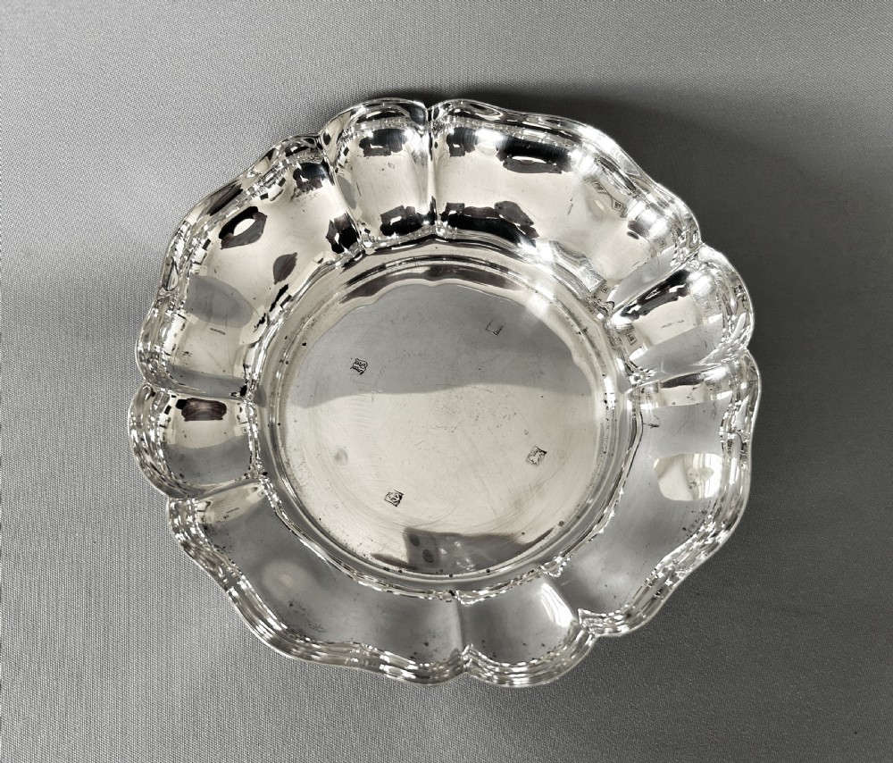 A handsome vintage silver wine bottle/decanter coaster View V