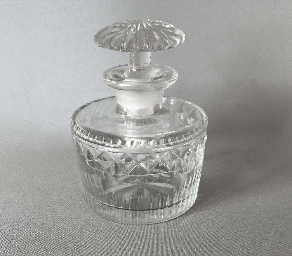 A Georgian Regency period cut glass table cologne bottle