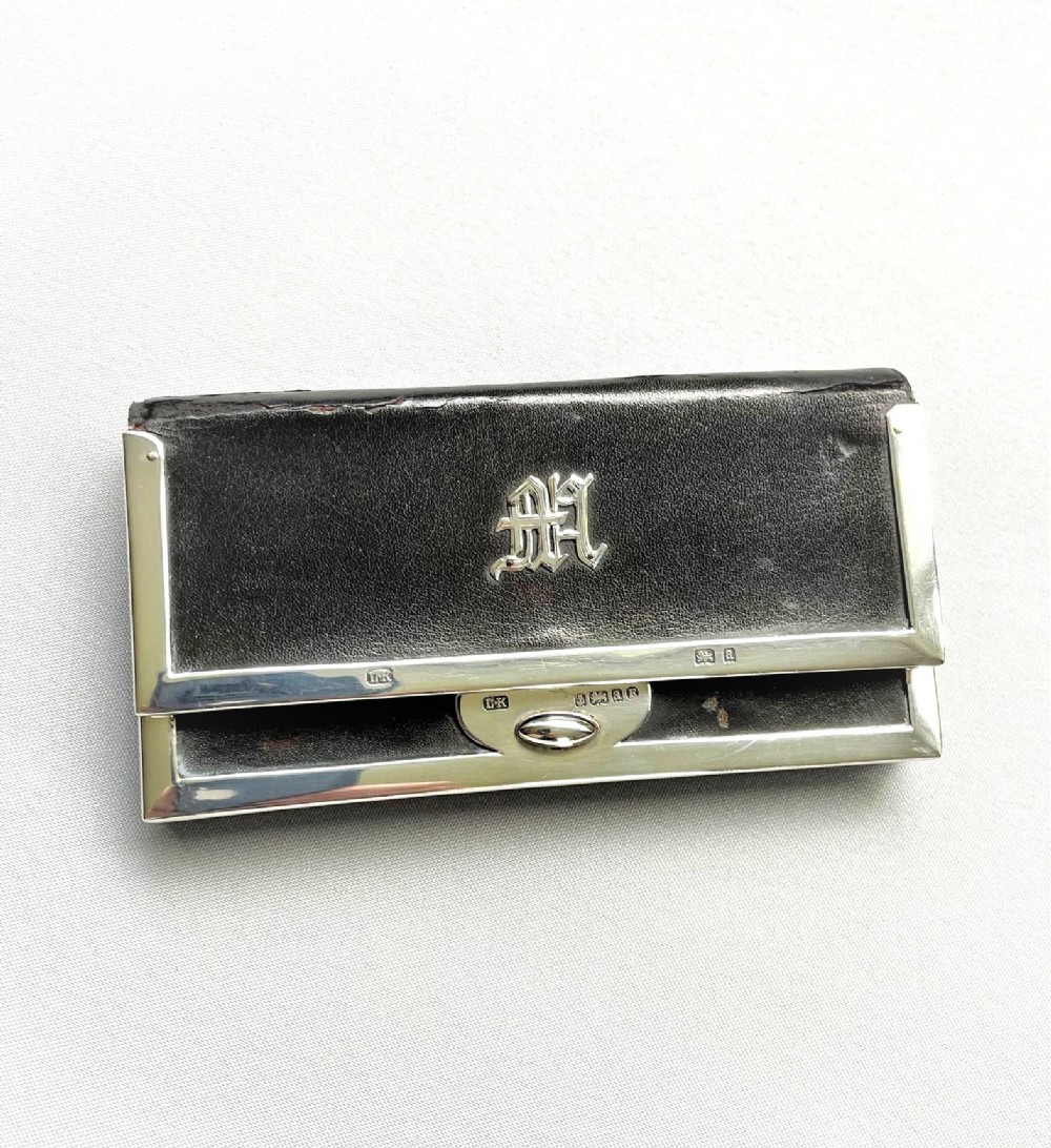 A late Victorian silver mounted purse/wallet