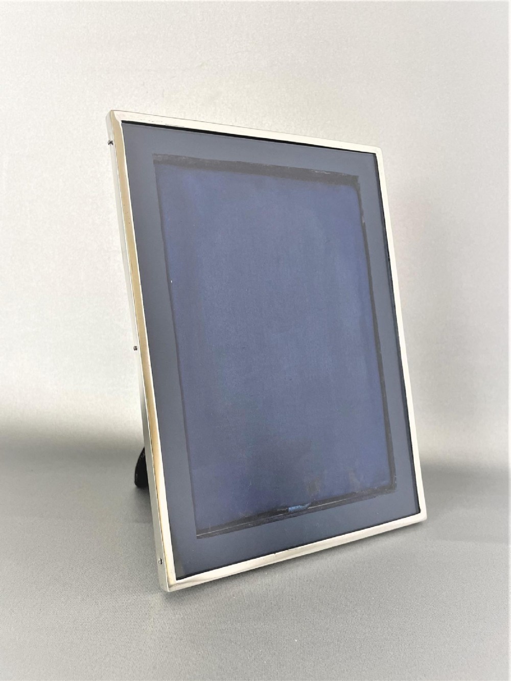 A stylish George V silver photo frame