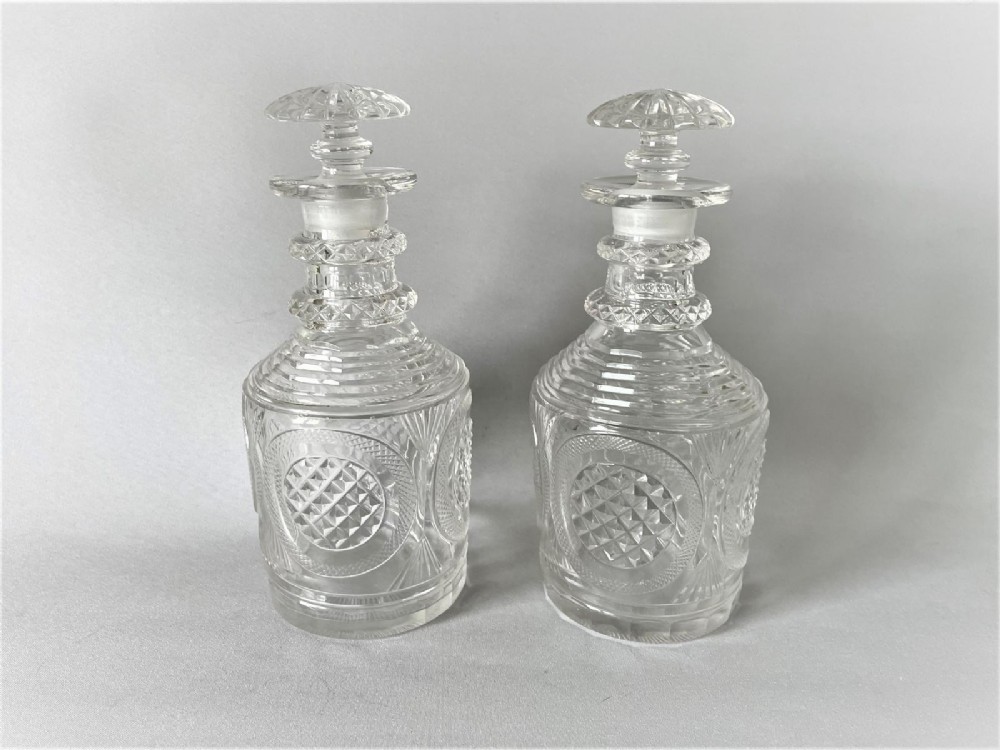 A gorgeous pair of Georgian Regency period cut glass decanters