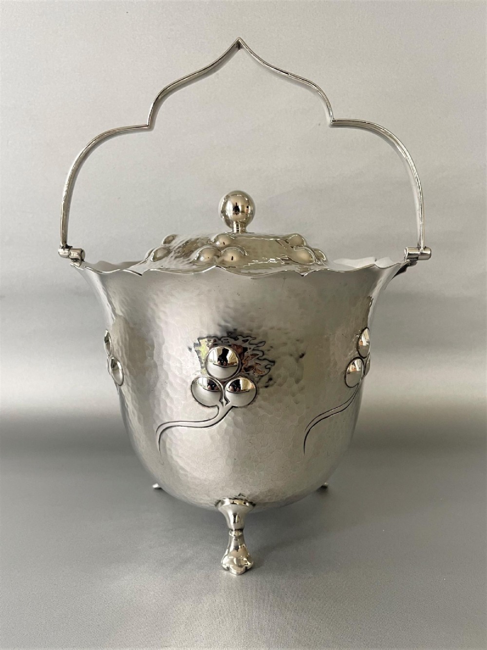 A stunning Arts & Crafts silver plated biscuit barrel