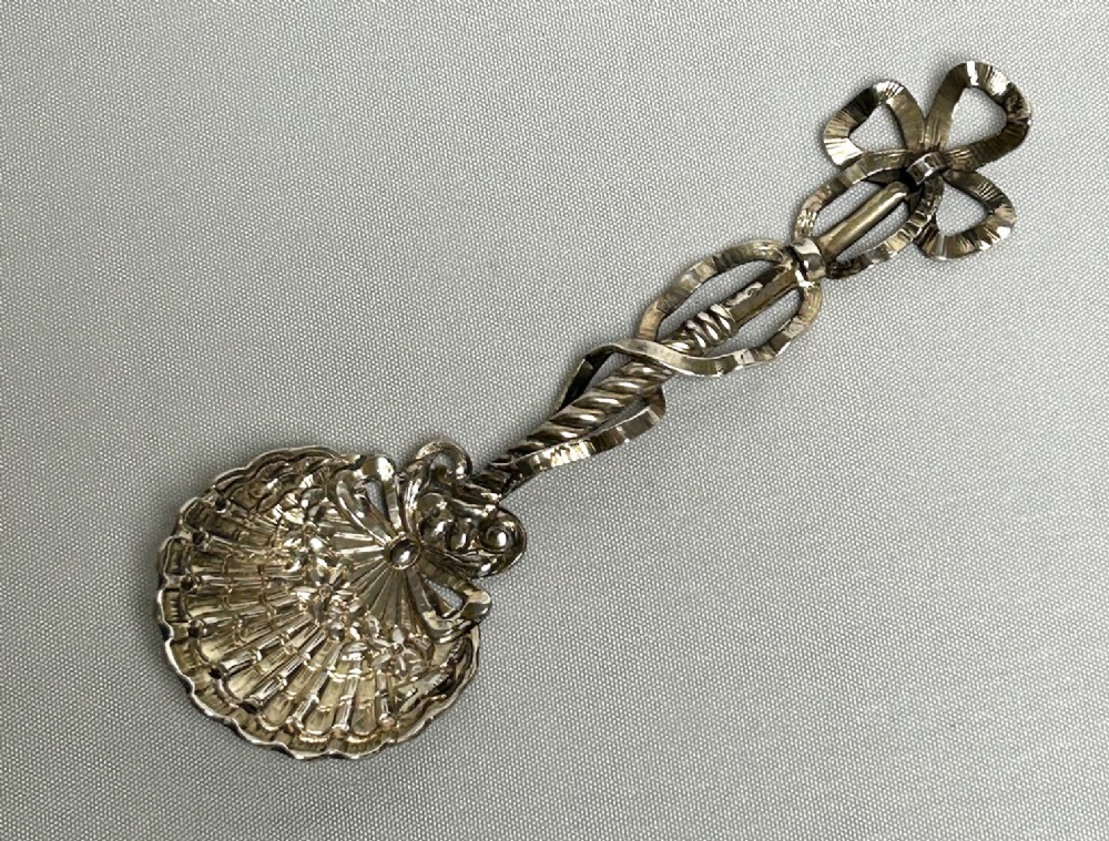 A superb cast Sterling silver preserve spoon