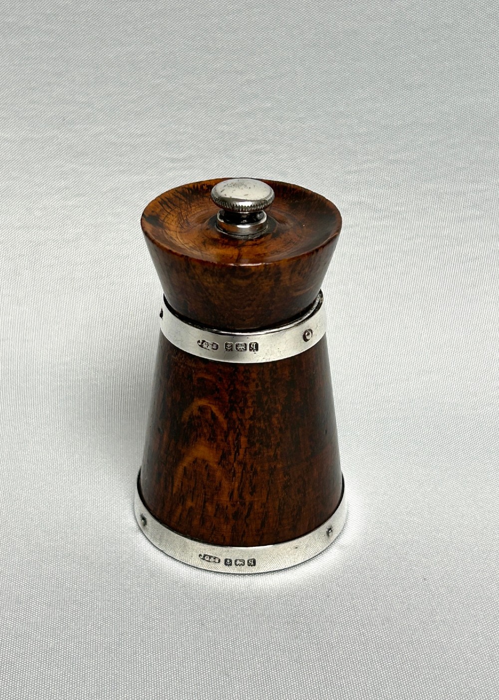 A handsome silver mounted pepper grinder