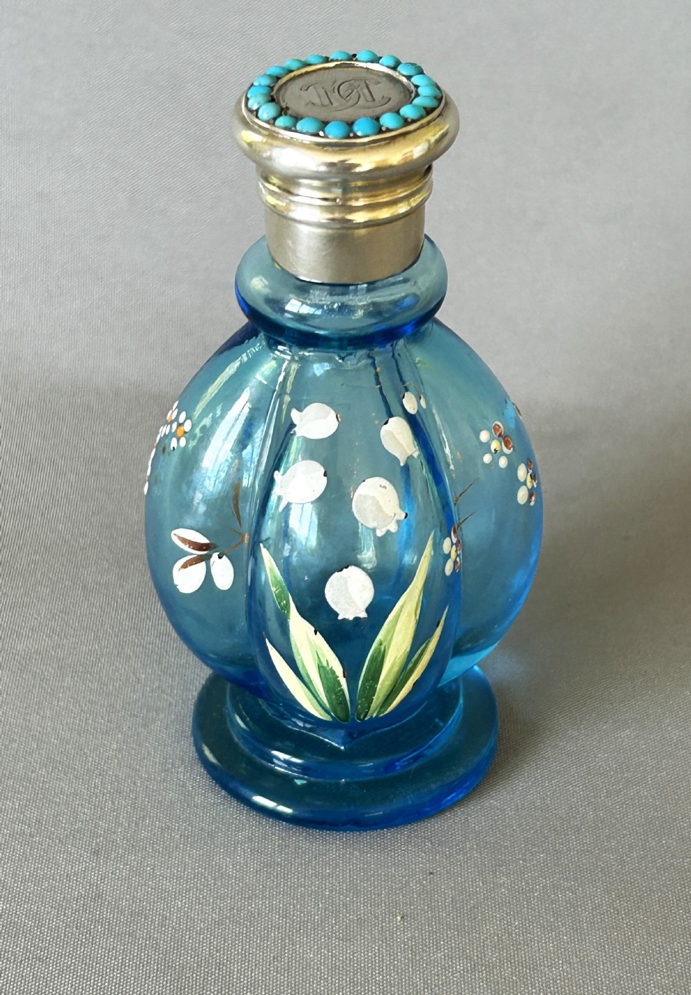 A fabulous victorian silver & turquoise mounted scent bottle