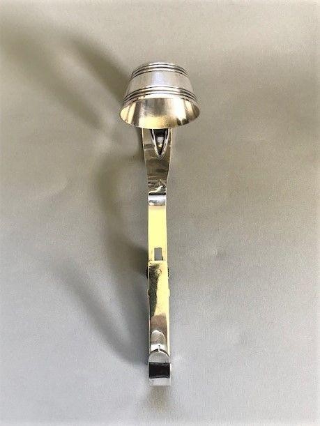 An Edwardian silver-plated champagne bottle holder featuring an adjustable collar mechanism and a curved pouring handle. View III