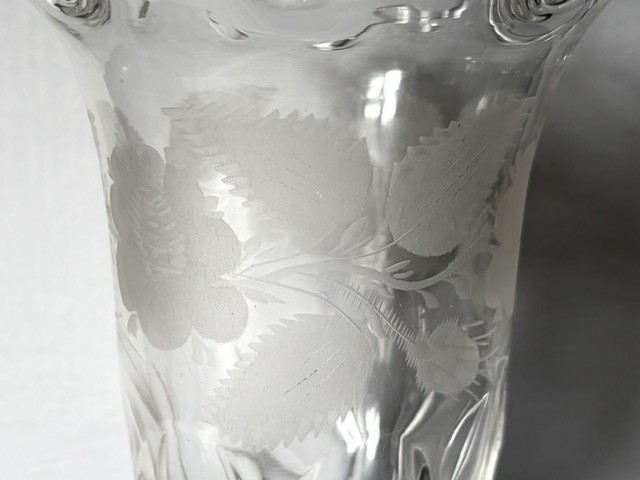 A clear glass Victorian celery vase featuring an etched floral pattern, a scalloped frilled rim, and a stemmed circular foot. View III