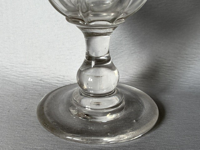 A clear glass Victorian celery vase featuring an etched floral pattern, a scalloped frilled rim, and a stemmed circular foot. View IV