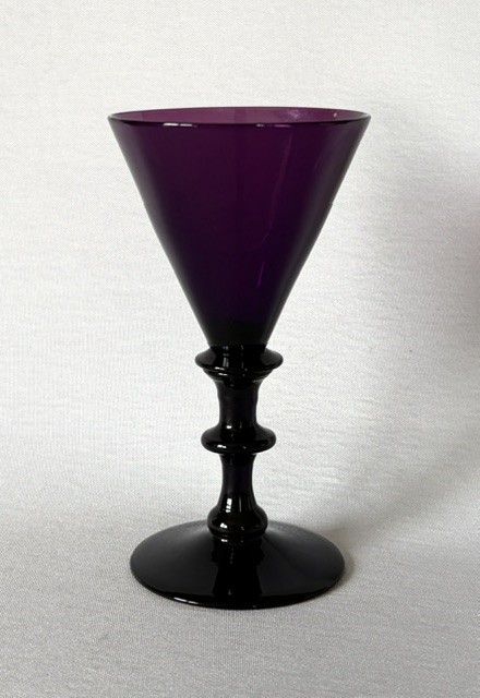 A Georgian purple amethyst glass wine flute featuring a conical bowl, double-knopped stem, and circular foot. View II