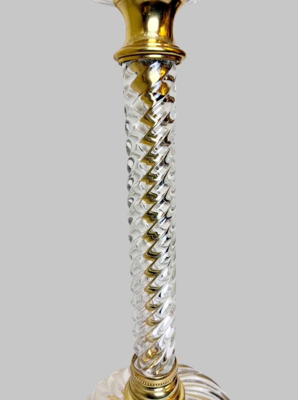 A 19th-century French table lamp featuring a twisted clear crystal column and swirled glass base accented with gilt bronze fittings. View IV