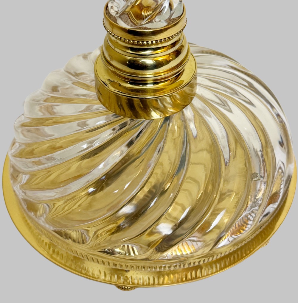 A 19th-century French table lamp featuring a twisted clear crystal column and swirled glass base accented with gilt bronze fittings. View VI